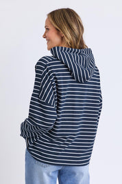 A model wearing the Fundamental Rhea Stripe Cotton Hoodie in colour Navystripe (Blue), from the back