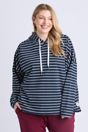 A model wearing the Fundamental Rhea Stripe Cotton Hoodie in colour Navystripe (Blue), from the front, cropped image