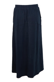 Product shot of the Fundamental Meadow Cotton Skirt – Navy in colour Navy, from the back