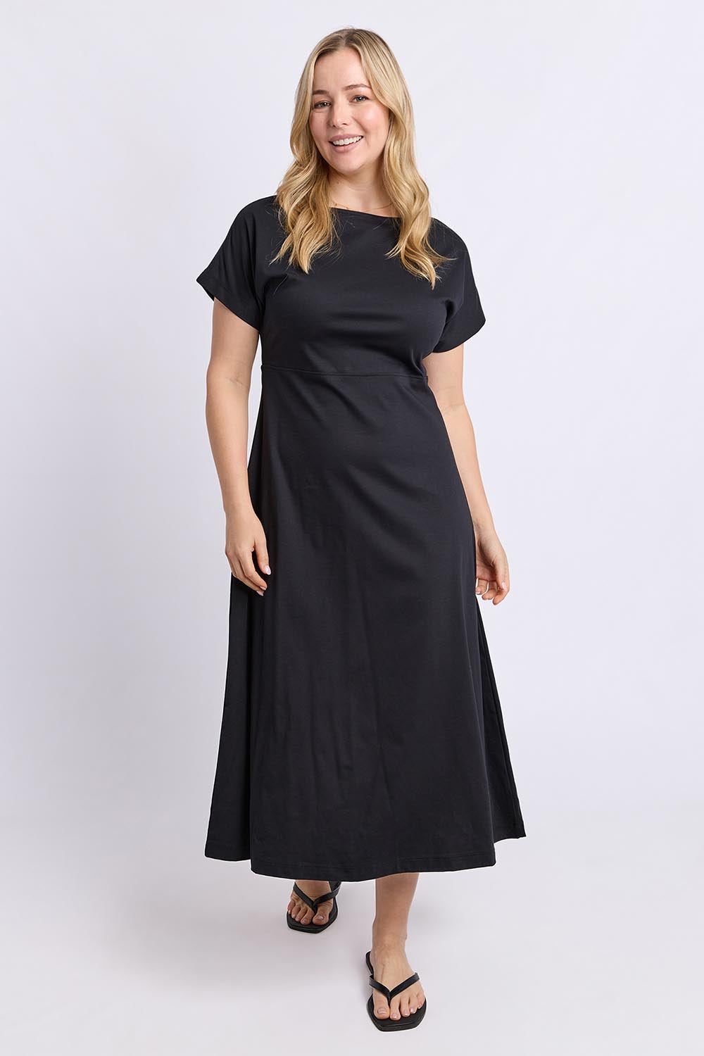 Model Genericm wearing size sample of the Fundamental Lottie Cotton Dress – Black in colour Black, from the front
