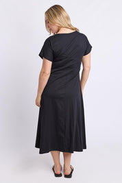 Model Genericm wearing size sample of the Fundamental Lottie Cotton Dress – Black in colour Black, from the front