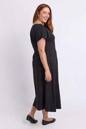 Model Genericm wearing size sample of the Fundamental Lottie Cotton Dress – Black in colour Black, from the front