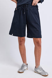 Model Genericm wearing size sample of the Fundamental Summer Fleece Cotton Short – Navy in colour Navy, from the front
