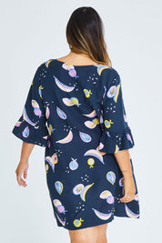 Model Palatina wearing size 16 of the Fruity Tootie Dress in colour Navymulti (Blue), from the back