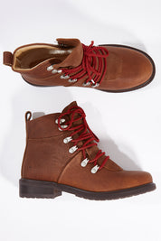 A model wearing size 7 of the Dongara Waterproof Leather Boot in colour Oak, from the front, showing the whole outfit