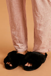 A model wearing size 8 of the Mayberry Slipper Slide in colour Black (Black), from the front, cropped image