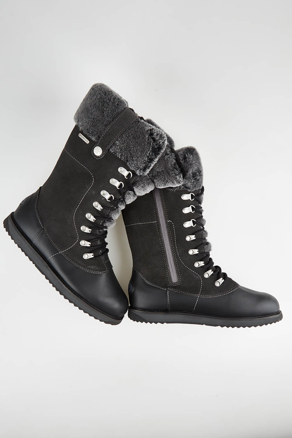 A model wearing size 7 of the Orica Hi Waterproof Leather Boot in colour Darkgrey (Grey), from the front, showing the whole outfit
