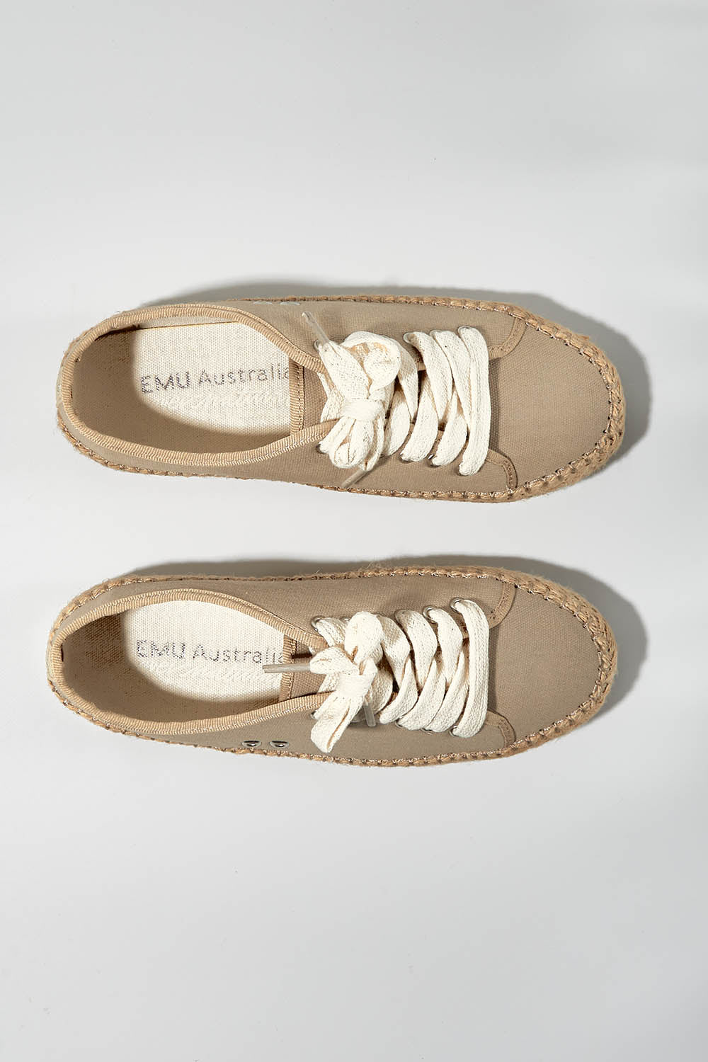 A model wearing size 7 of the Agonis Organic Sneaker in colour Almond, from the front, showing the whole outfit