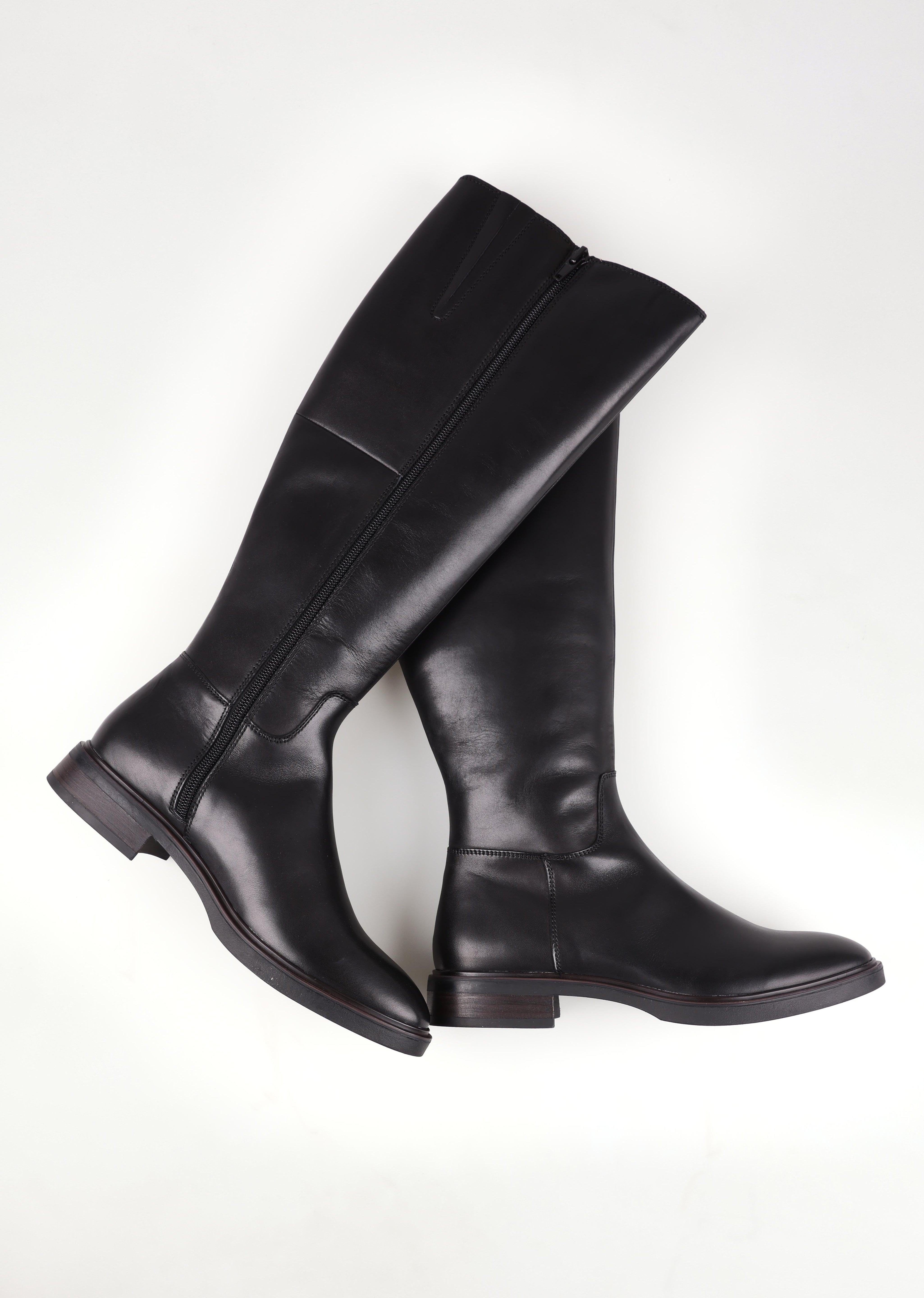 A model wearing size 37 of the Blanche Leather Knee Boot in colour Black (Black), from the front, showing the whole outfit
