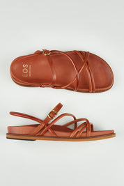 A model wearing size 37 of the Carmina Leather Flat in colour Brandy, from the front, showing the whole outfit