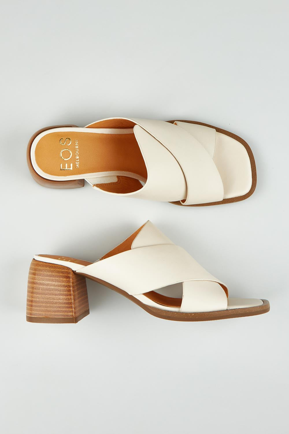 A model wearing size 37 of the Iso Leather Heel in colour Bone, from the front, showing the whole outfit