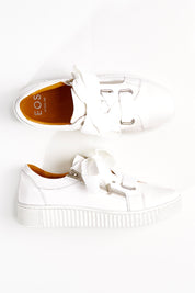 A model wearing size 36 of the Jovi Leather Sneaker in colour Whitewhite (White), from the front, showing the whole outfit