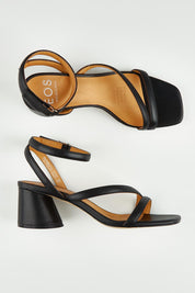 A model wearing size 37 of the Petricia Leather Heel in colour Black (Black), from the front, showing the whole outfit