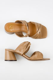 Model Genericm wearing size sample of the Petris Heel - Pecan in colour Pecan, from an angle