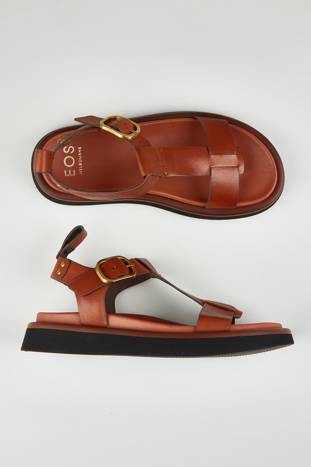 A model wearing size 37 of the Slays Leather Sandal in colour Brandy, from the front, showing the whole outfit