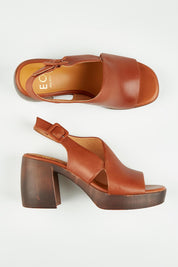A model wearing size 37 of the Spicer Leather Heel in colour Brandy, from the front, showing the whole outfit