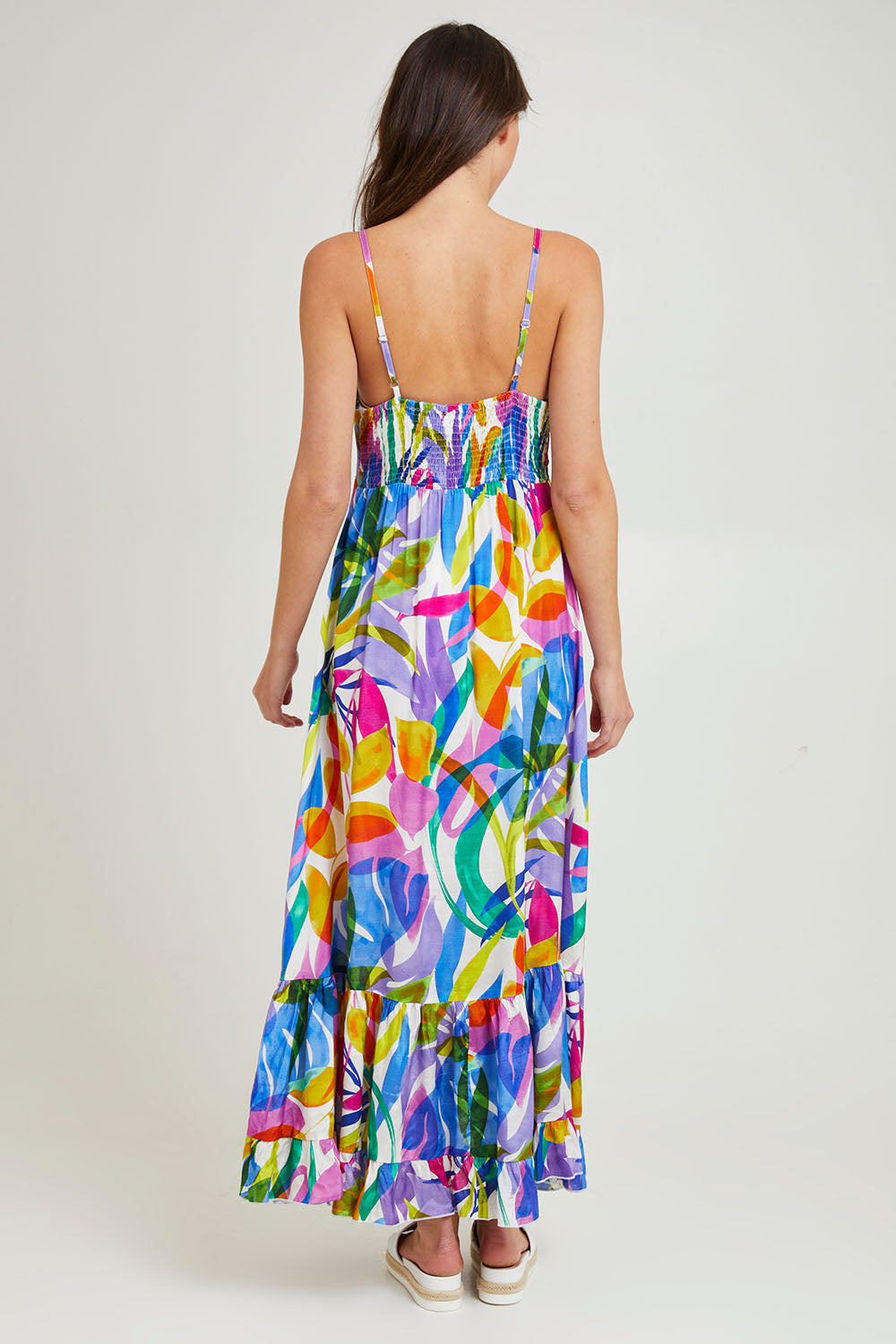 Model Madeline wearing size 10 of the Melinda White Maxi Strappy Dress in colour White (Blue), from the back