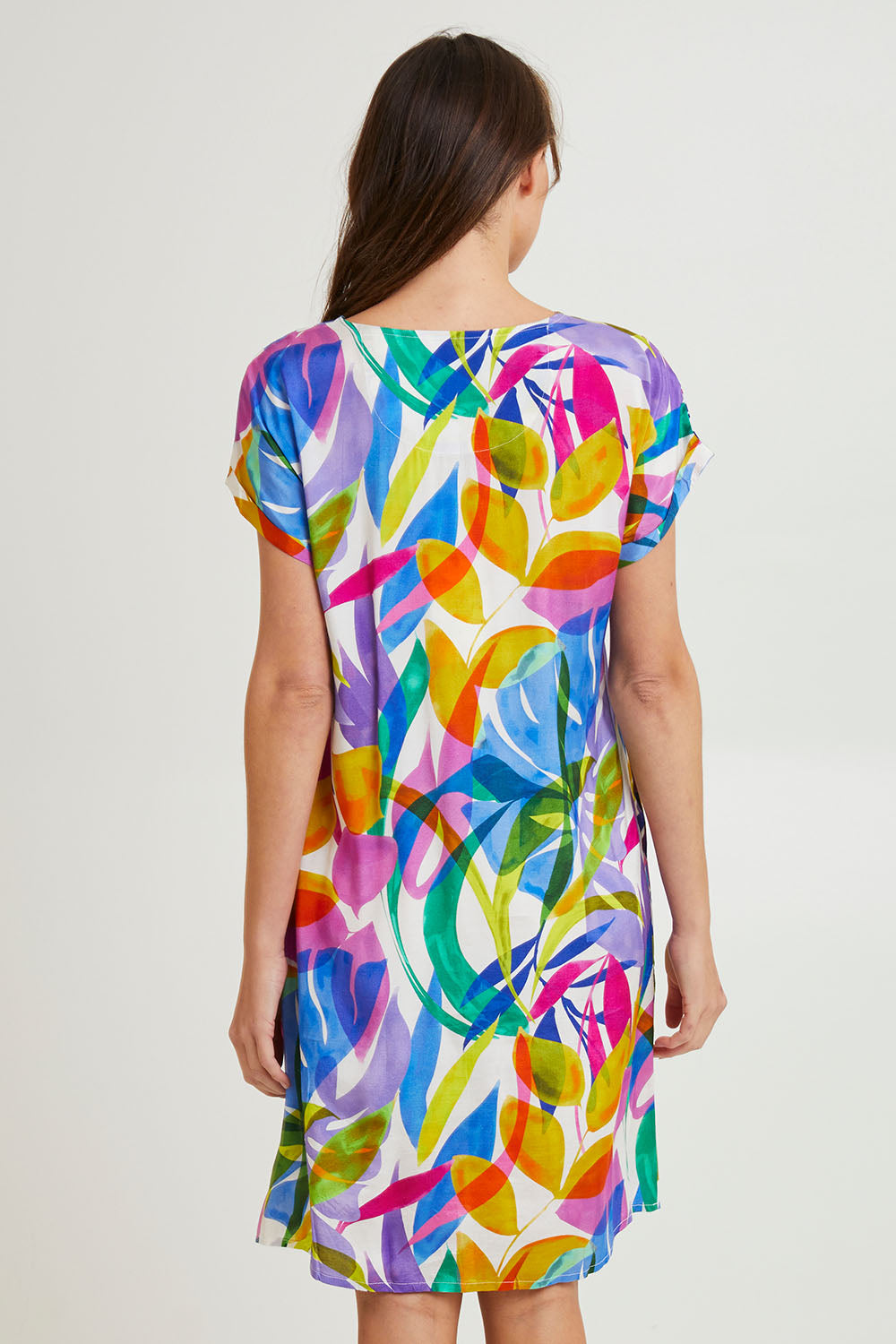 Model Madeline wearing size 10 of the Melinda White Shift Short Sleeve Dress in colour White (Blue), from the back