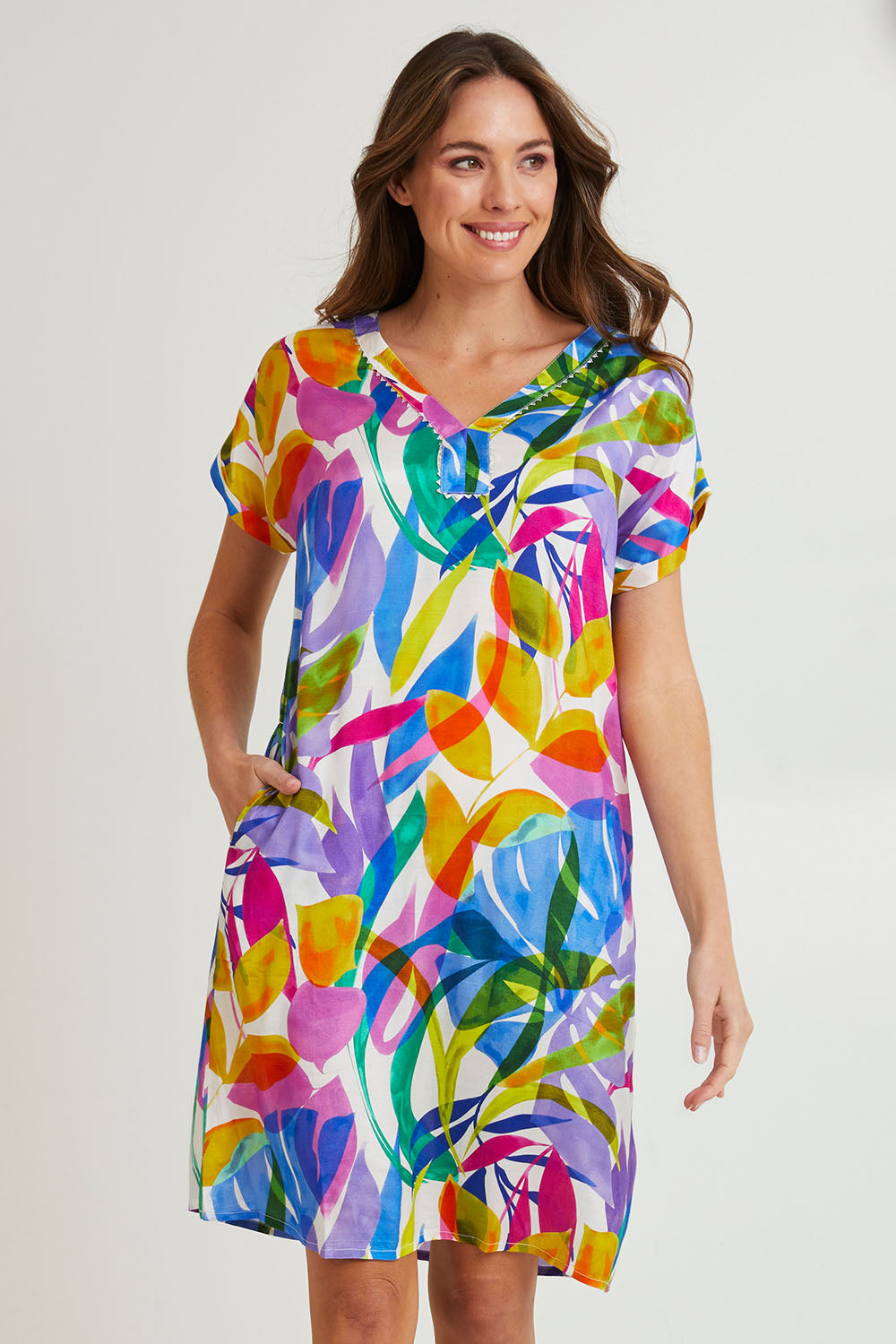 Model Madeline wearing size 10 of the Melinda White Shift Short Sleeve Dress in colour White (Blue), from the front, cropped image
