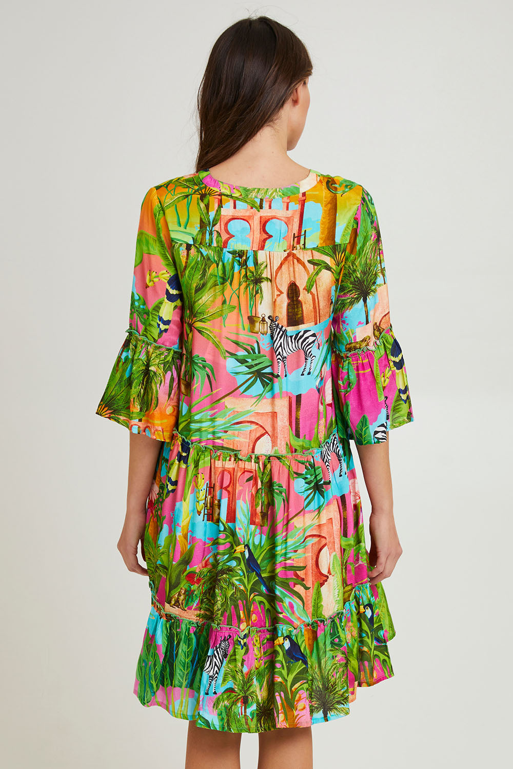 Model Madeline wearing size 10 of the Lani Frill 3/4 Sleeve Dress in colour Print (Green), from the back
