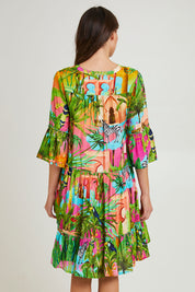 Model Madeline wearing size 10 of the Lani Frill 3/4 Sleeve Dress in colour Print (Green), from the back