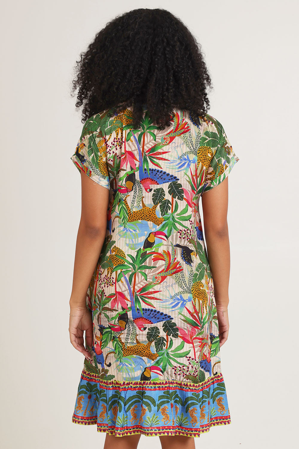 Model Ziara wearing size 10 of the Dani Short Sleeve Frill Dress in colour Print, from the back