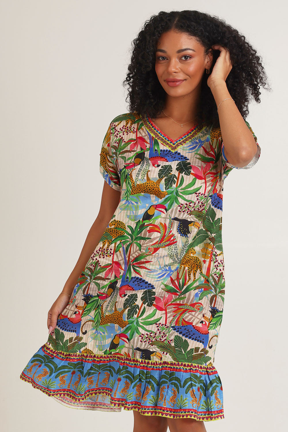 Model Ziara wearing size 10 of the Dani Short Sleeve Frill Dress in colour Print, from the front, cropped image