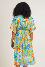 Model Ziara wearing size 10 of the Fiorella Waist Dress in colour Print, from the back