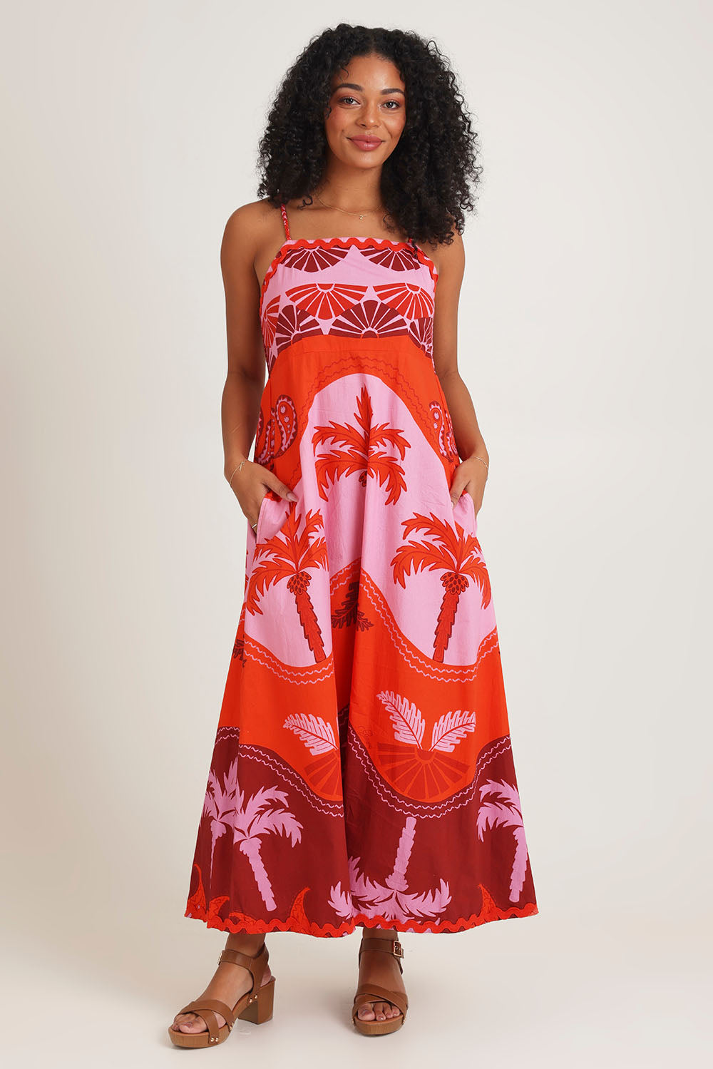Model Ziara wearing size 10 of the Celeste Orange Cotton Strappy Dress in colour Orange, from the front, showing the whole outfit