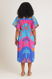 Model Ziara wearing size 10 of the Celestial Blue Cotton Midi Dress in colour Blue, from the back
