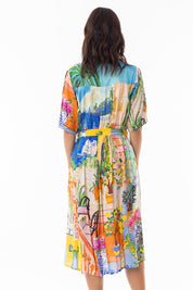 A model wearing the Sardinia Tie Waist Dress in colour Print, from the back