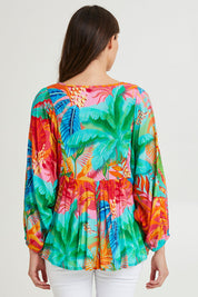 Model Madeline wearing size 10 of the Alisa Boho Top in colour Print (Green), from the back