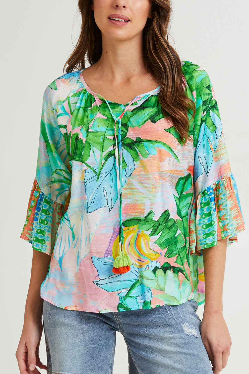 Model Madeline wearing size 10 of the Talia Boho Top in colour Print (Green), from the front, cropped image