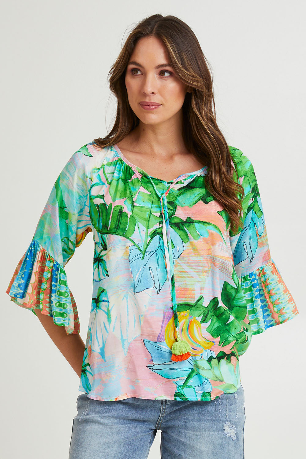 Model Madeline wearing size 10 of the Talia Boho Top in colour Print (Green), from the front, cropped image