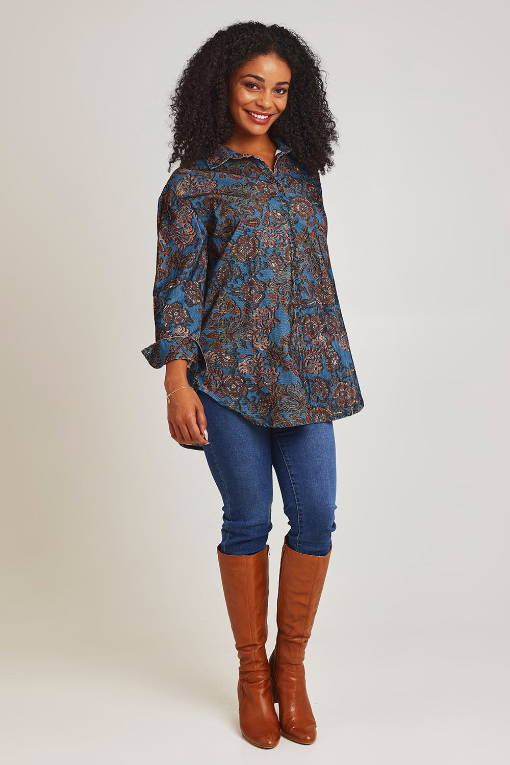 Model Ziara wearing size 10 of the Iguazu Cotton Shirt in colour Iguazu (Blue), from the front, showing the whole outfit