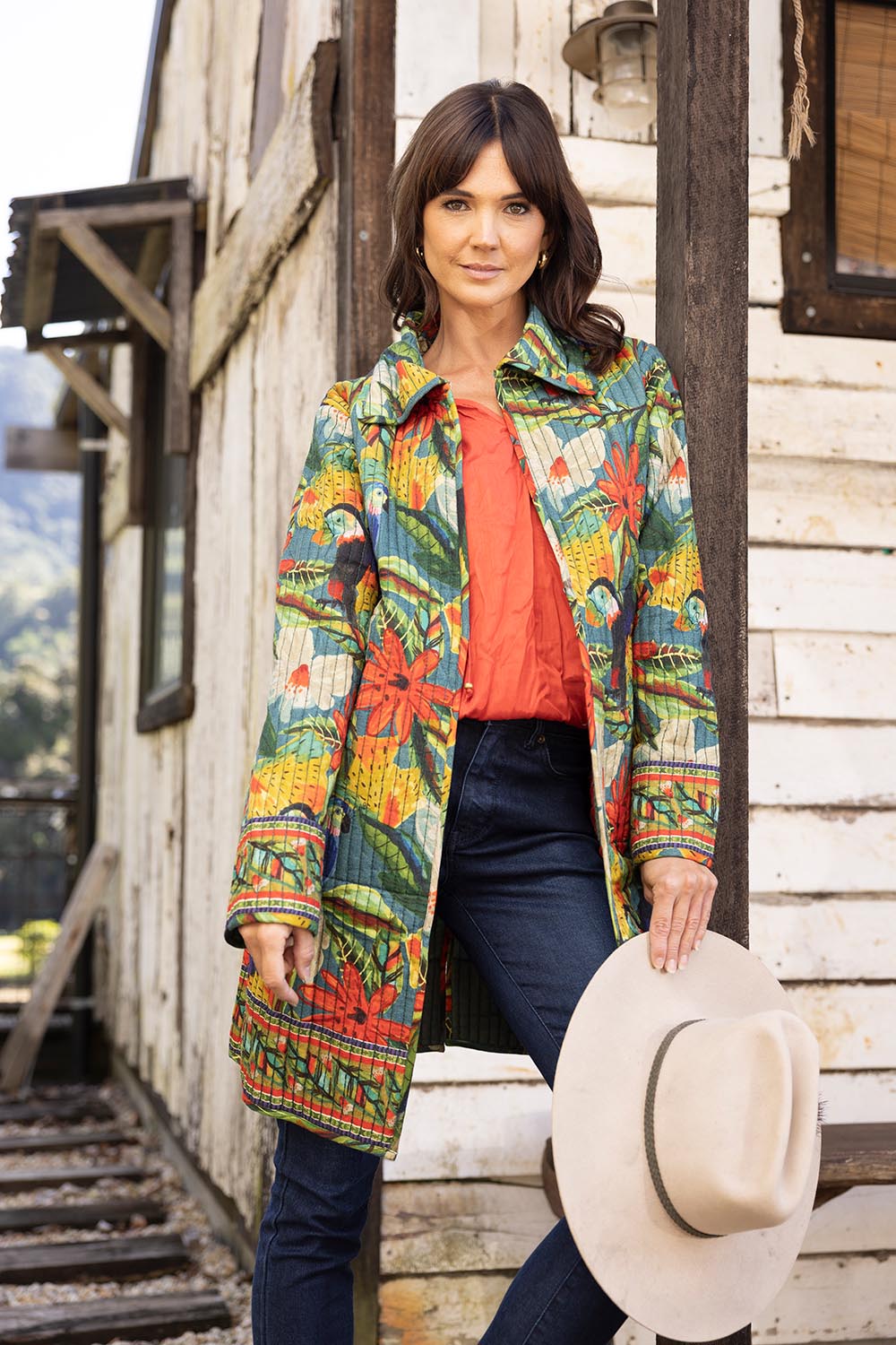 A model wearing the Galapagos Quilted Coat in colour Galapagos, from the front, showing the whole outfit