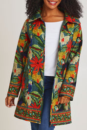 Model Ziara wearing size 10 of the Galapagos Quilted Coat in colour Galapagos, from the front, cropped image
