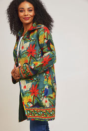 Model Ziara wearing size 10 of the Galapagos Quilted Coat in colour Galapagos, from the front, cropped image