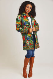 Model Ziara wearing size 10 of the Galapagos Quilted Coat in colour Galapagos, from the front, showing the whole outfit