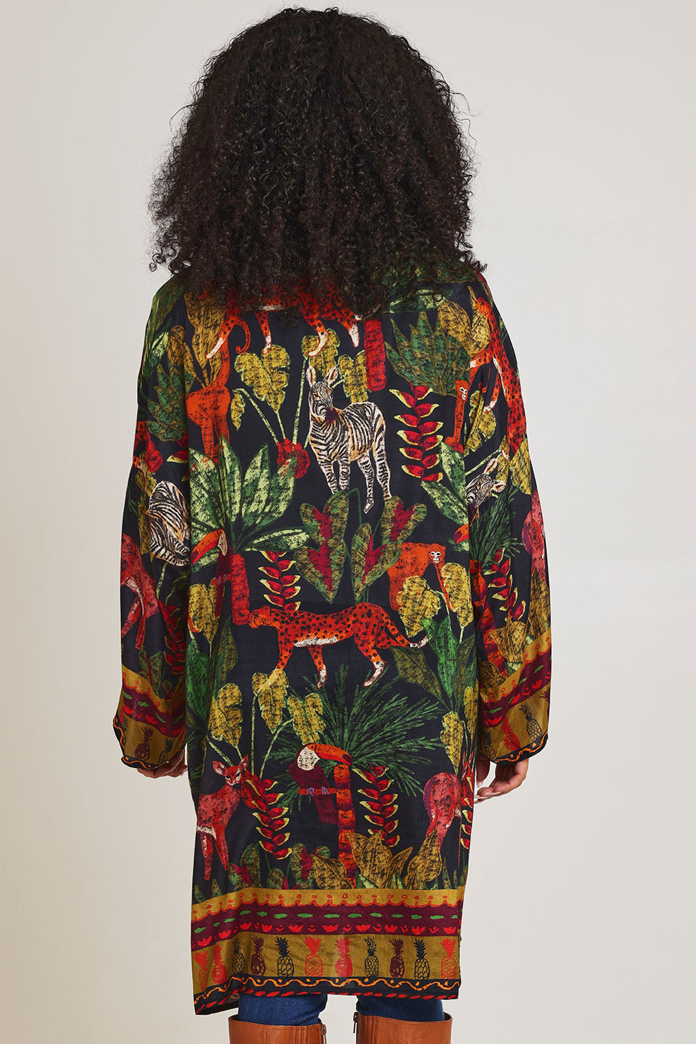 Model Ziara wearing size 10 of the Amazonia Kimono in colour Amazonia, from the back