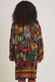 Model Ziara wearing size 10 of the Amazonia Kimono in colour Amazonia, from the back