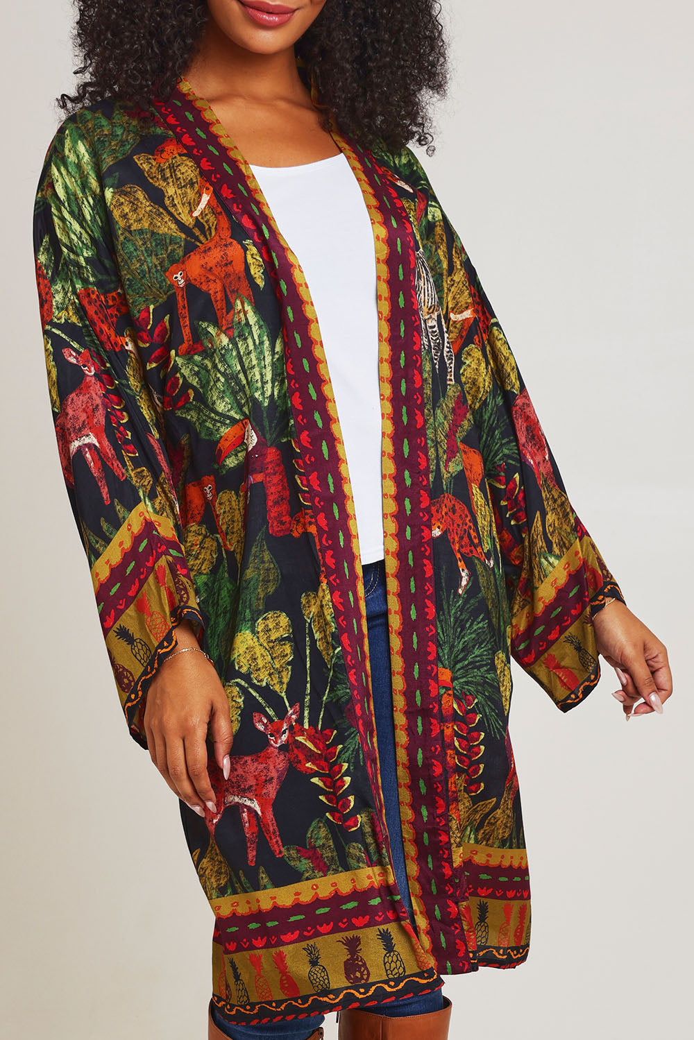 Model Ziara wearing size 10 of the Amazonia Kimono in colour Amazonia, from the front, cropped image
