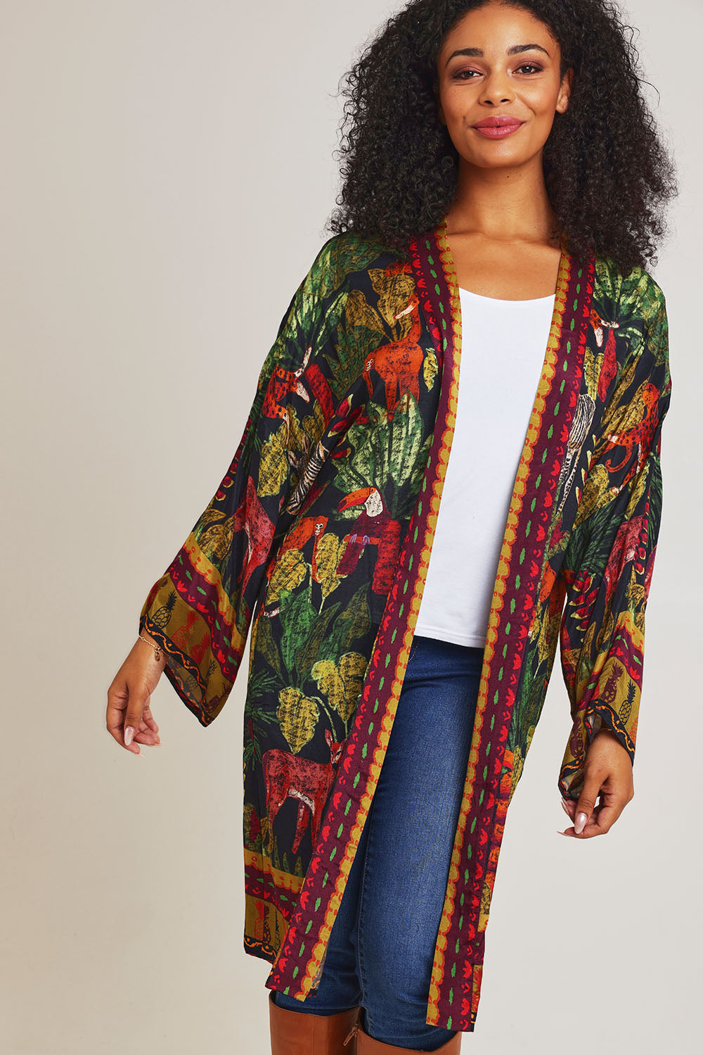 Model Ziara wearing size 10 of the Amazonia Kimono in colour Amazonia, from the front, cropped image