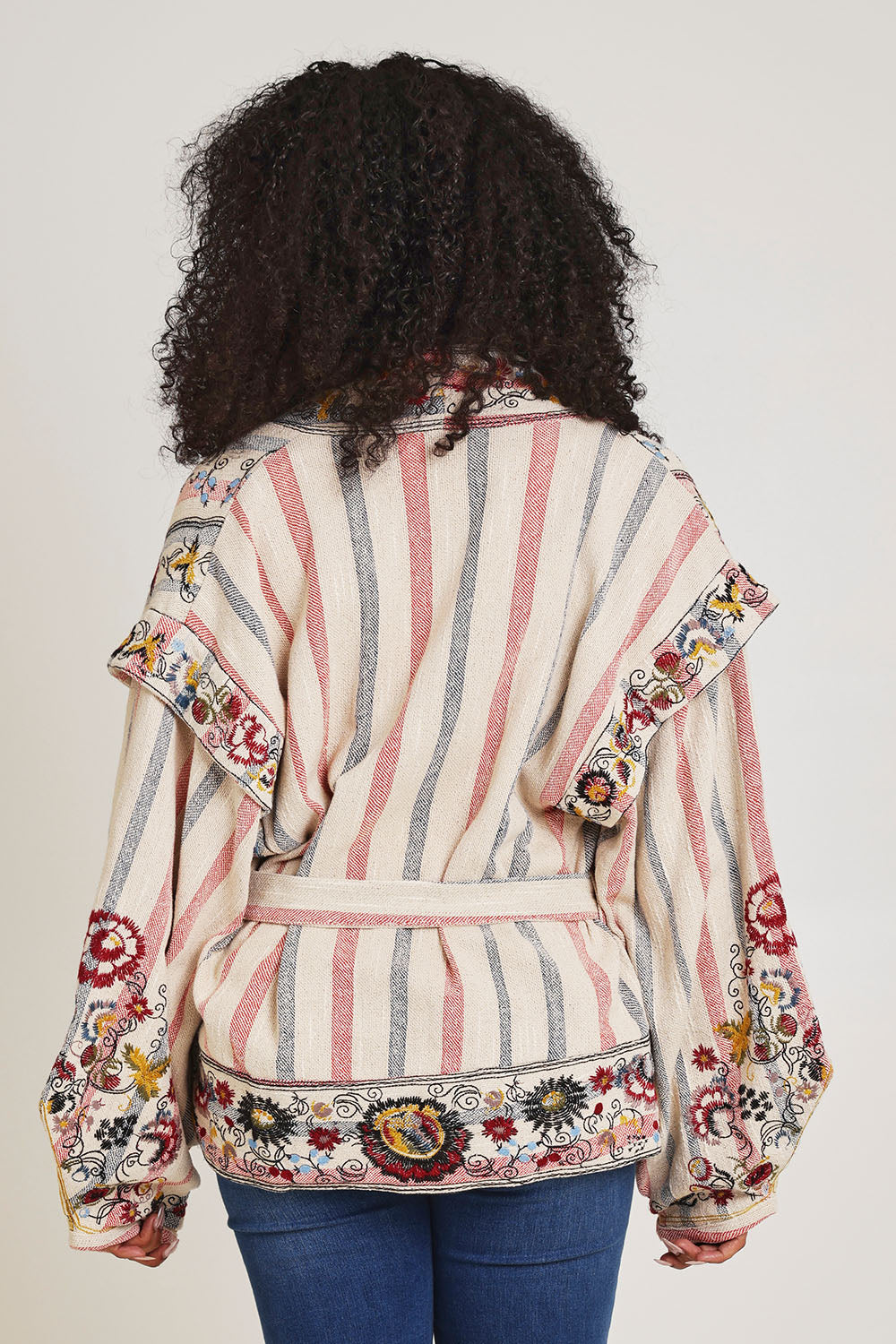 Model Ziara wearing size 10 of the Embroidered Cotton Jacket in colour Print, from the back