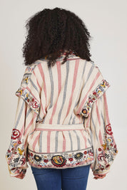 Model Ziara wearing size 10 of the Embroidered Cotton Jacket in colour Print, from the back