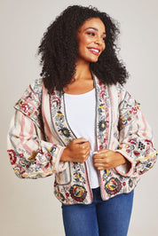 Model Ziara wearing size 10 of the Embroidered Cotton Jacket in colour Print, from the front, cropped image