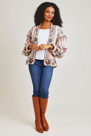 Model Ziara wearing size 10 of the Embroidered Cotton Jacket in colour Print, from the front, showing the whole outfit