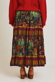 Model Ziara wearing size 10 of the Amazonia Skirt in colour Amazonia, from the back