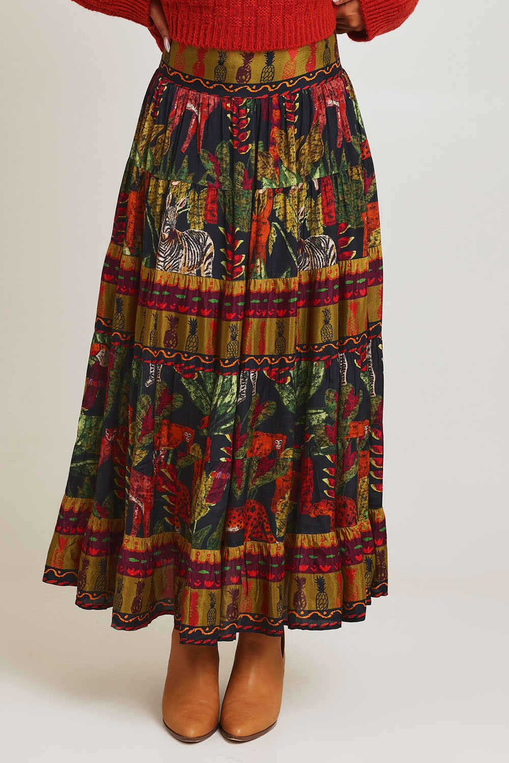 Model Ziara wearing size 10 of the Amazonia Skirt in colour Amazonia, from the front, cropped image