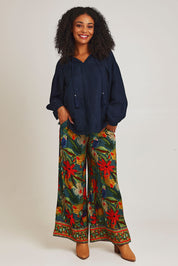 Model Ziara wearing size 10 of the Galapagos Pant in colour Galapagos, from the front, showing the whole outfit